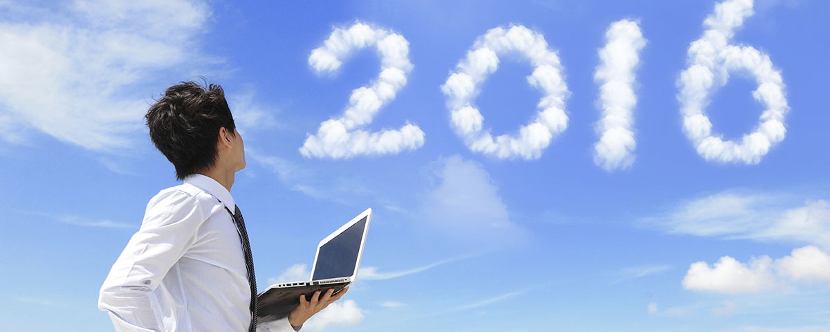 Young business man using laptop and look to 2022 year text with blue sky and cloud and cityscape in the background, asian
